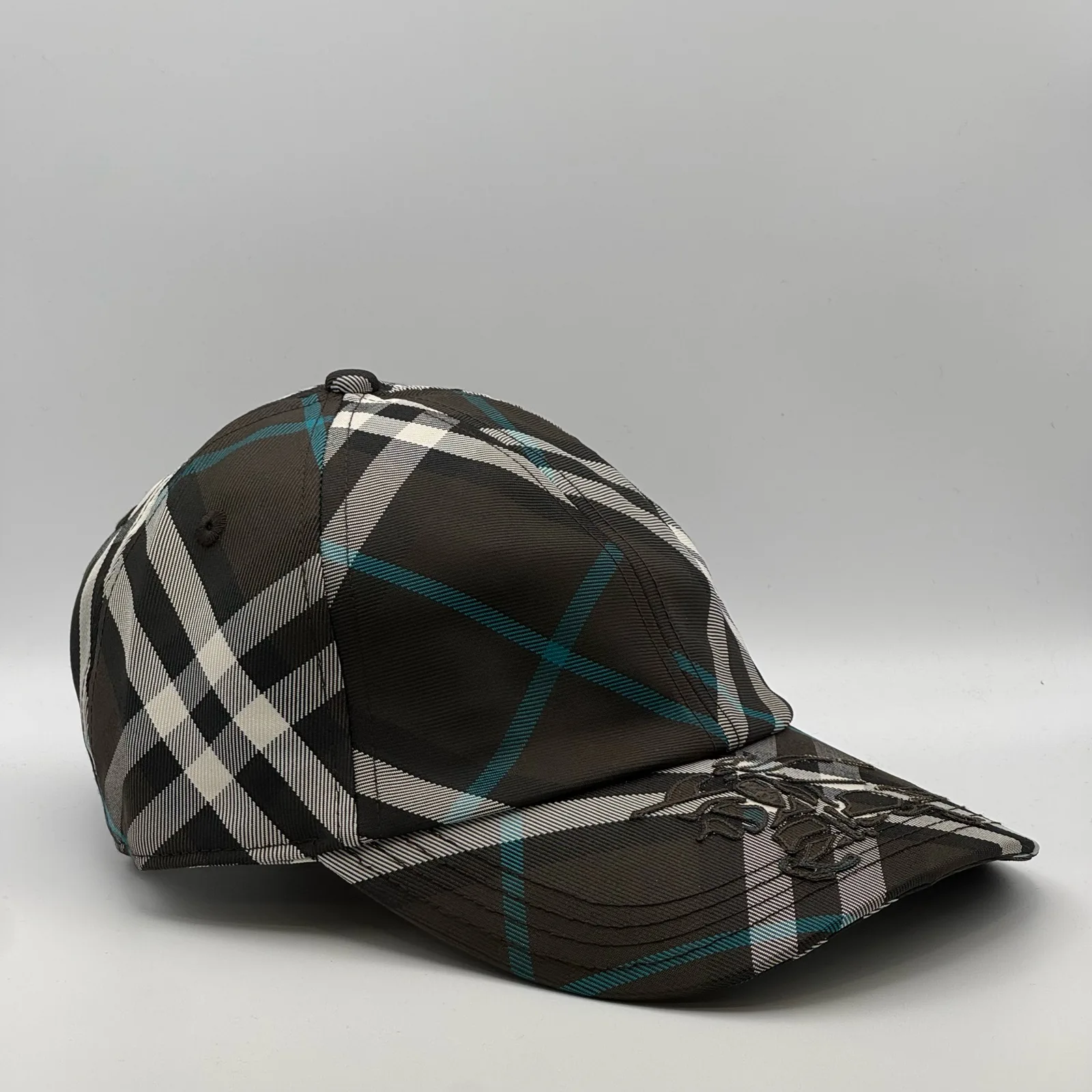 Dark brown check Burberry cap, three-quarter front-left view.