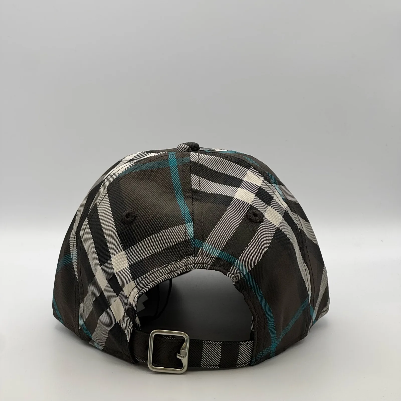 Dark brown check Burberry cap, back view showing the metal buckle strap.