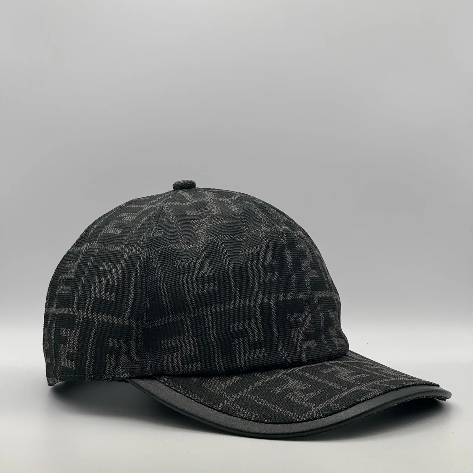 Black-on-black Fendi FF cap, side profile.
