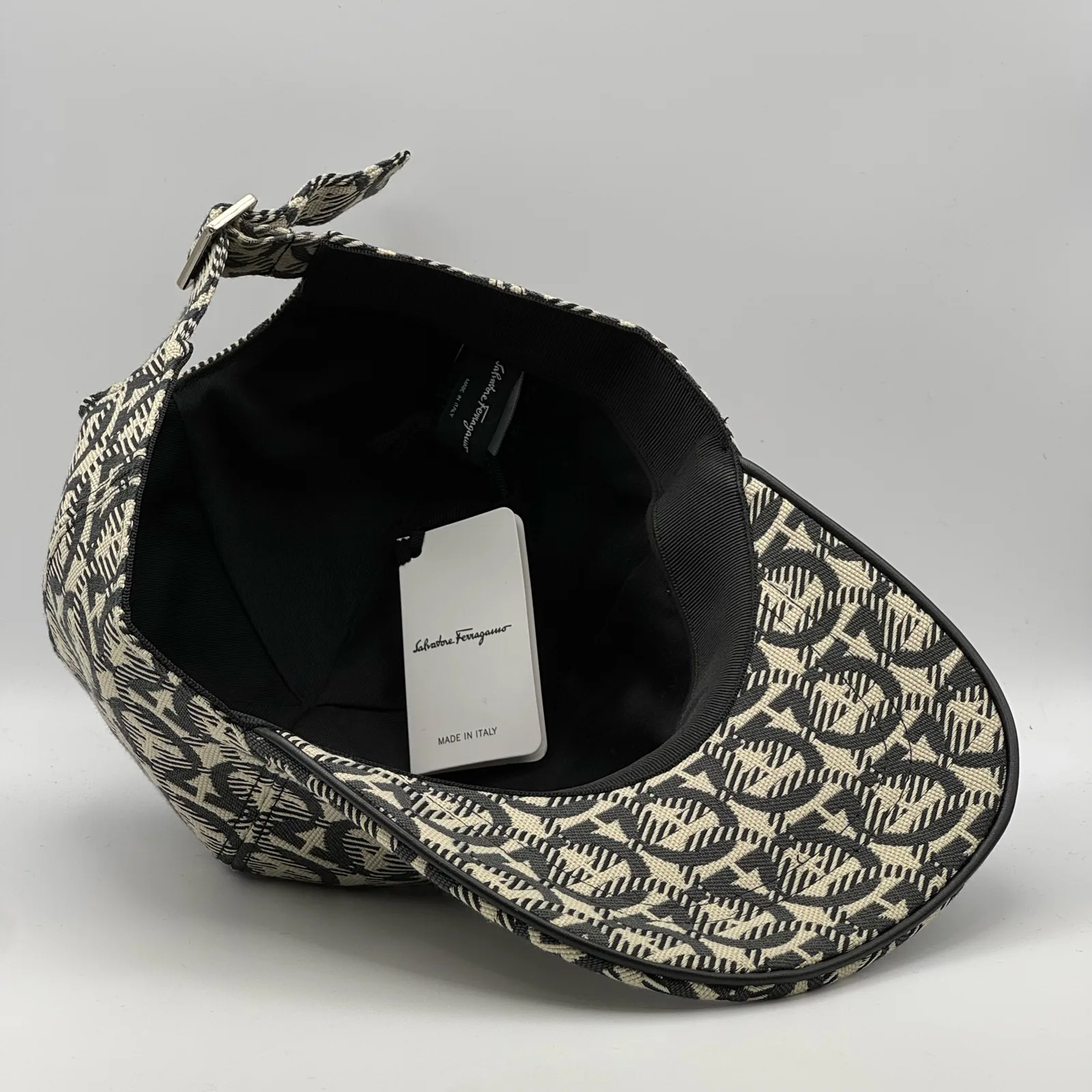 Ferragamo Gancini cap, underside view showing the black interior lining.
