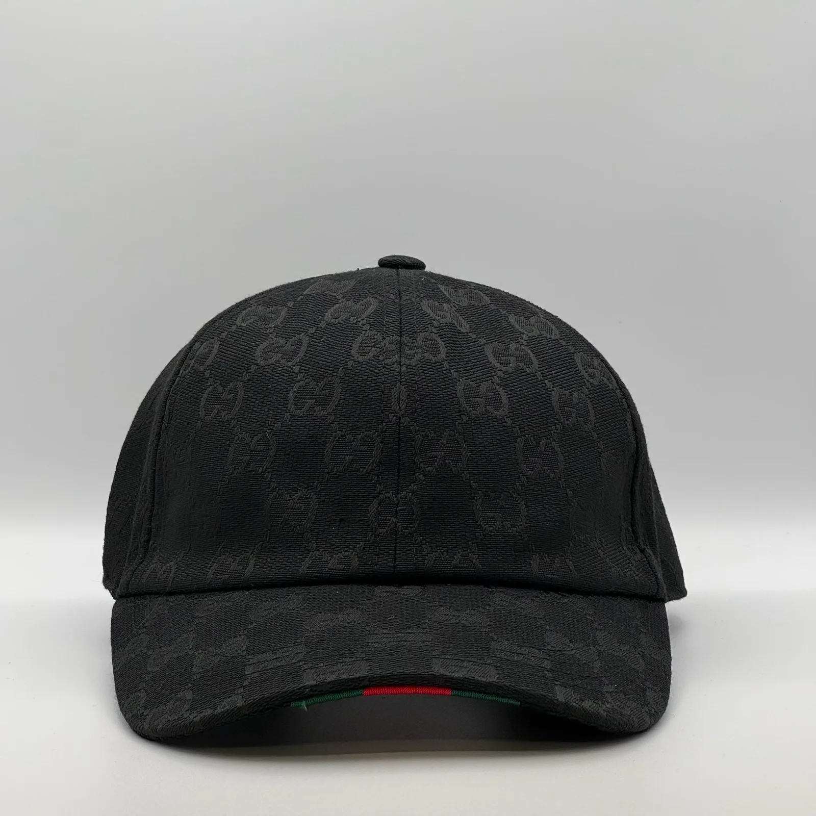 Black GG canvas cap, front three-quarter view with a subtle tonal jacquard pattern