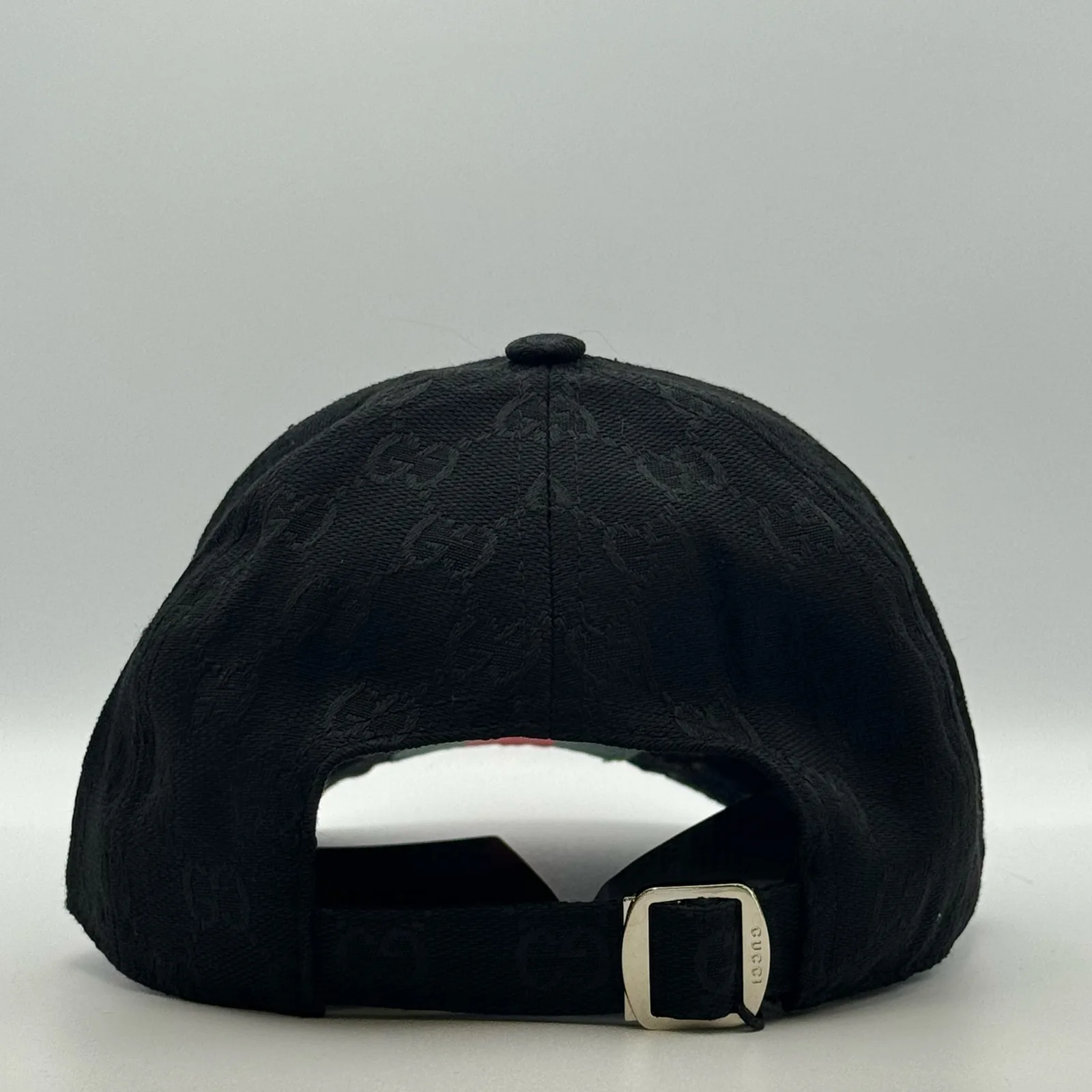 Black GG canvas cap, back view showing the adjustable strap and buckle
