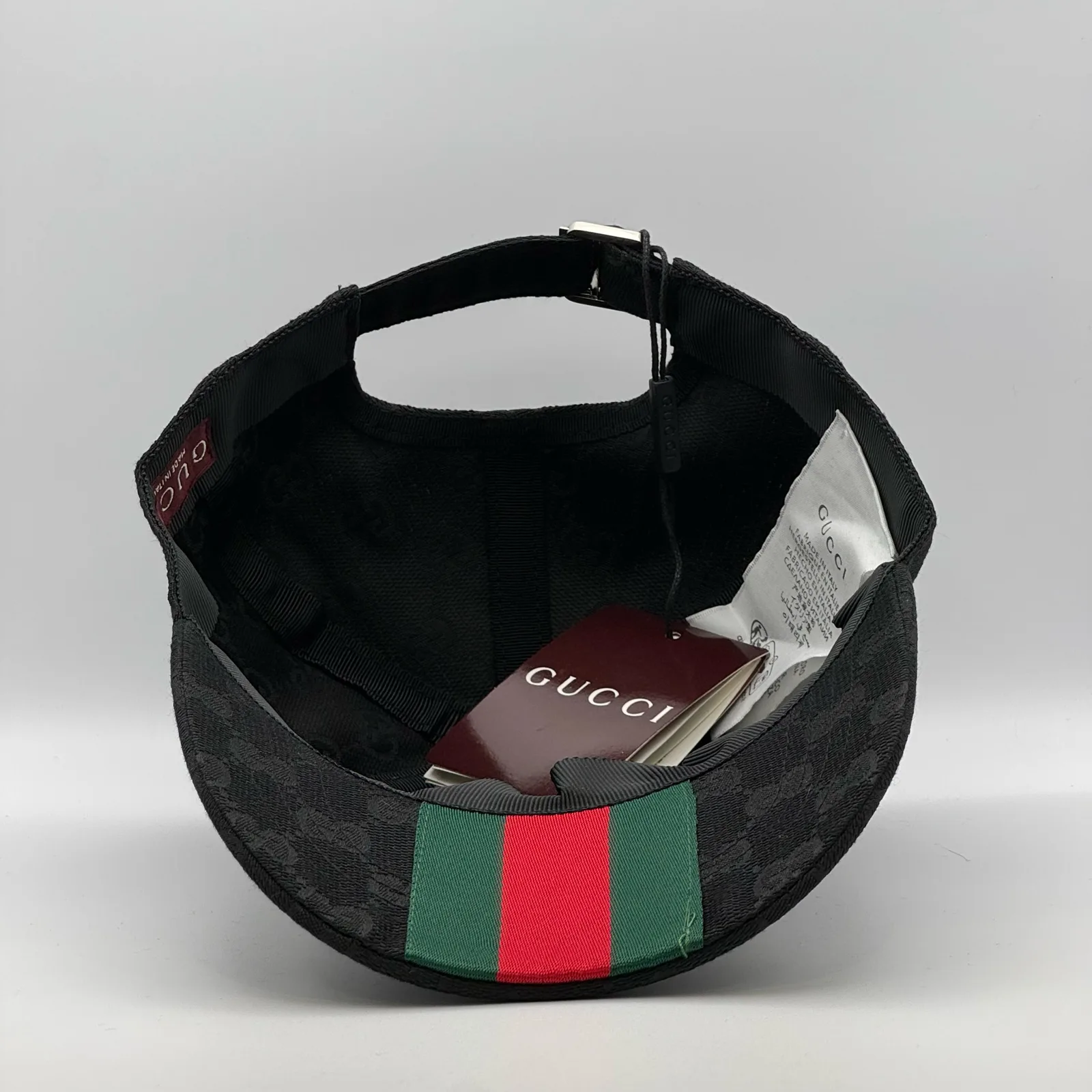 Black GG canvas cap, underside view showing the green and red web stripe lining