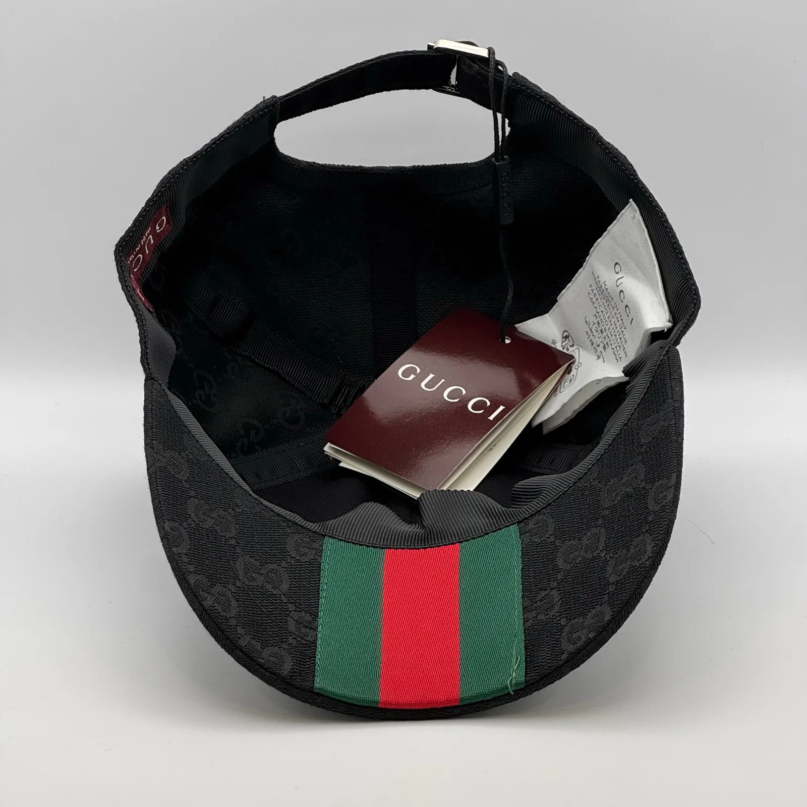 Black GG canvas cap, interior view with brand booklet and tags