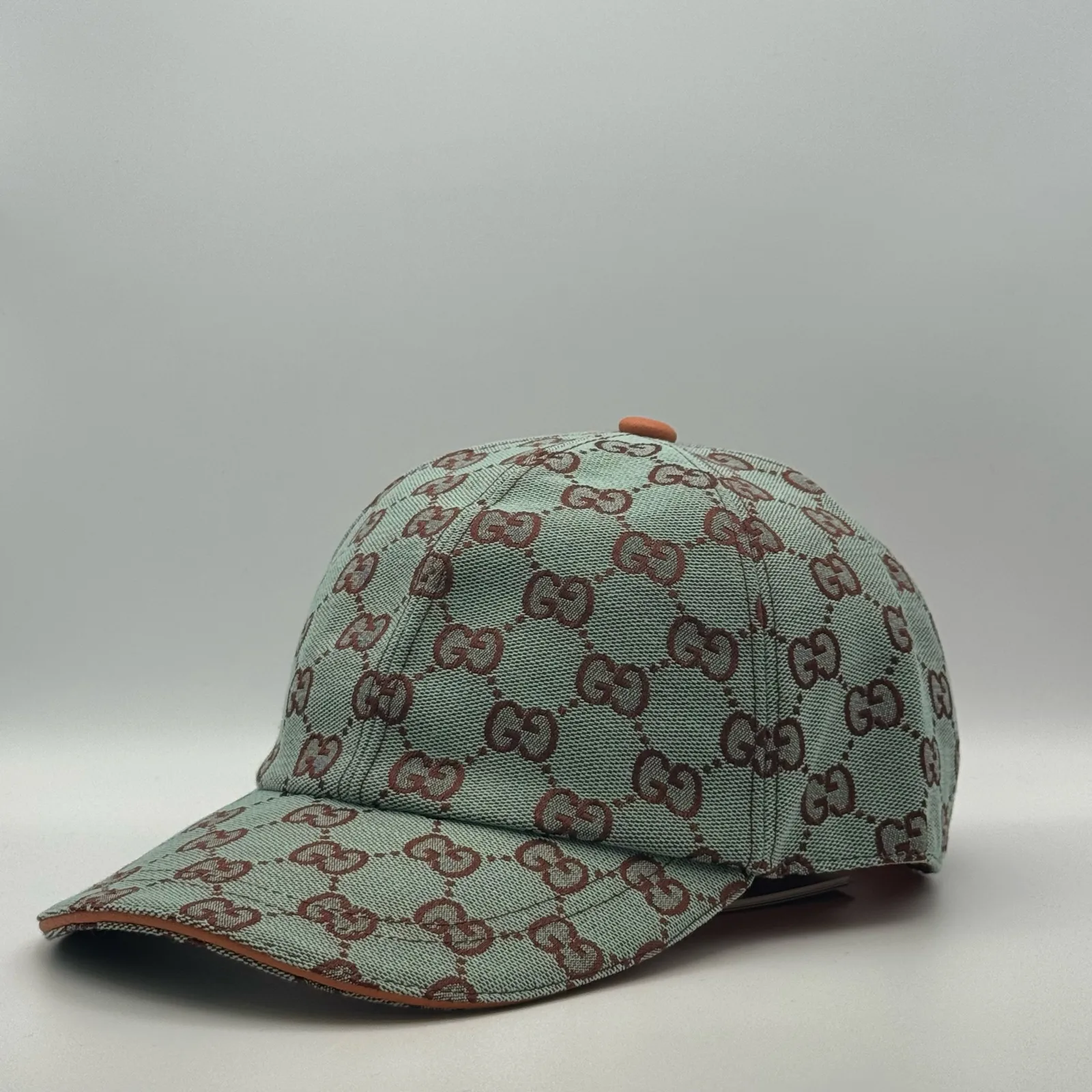 Mint green GG canvas cap, front view showing the brown jacquard pattern