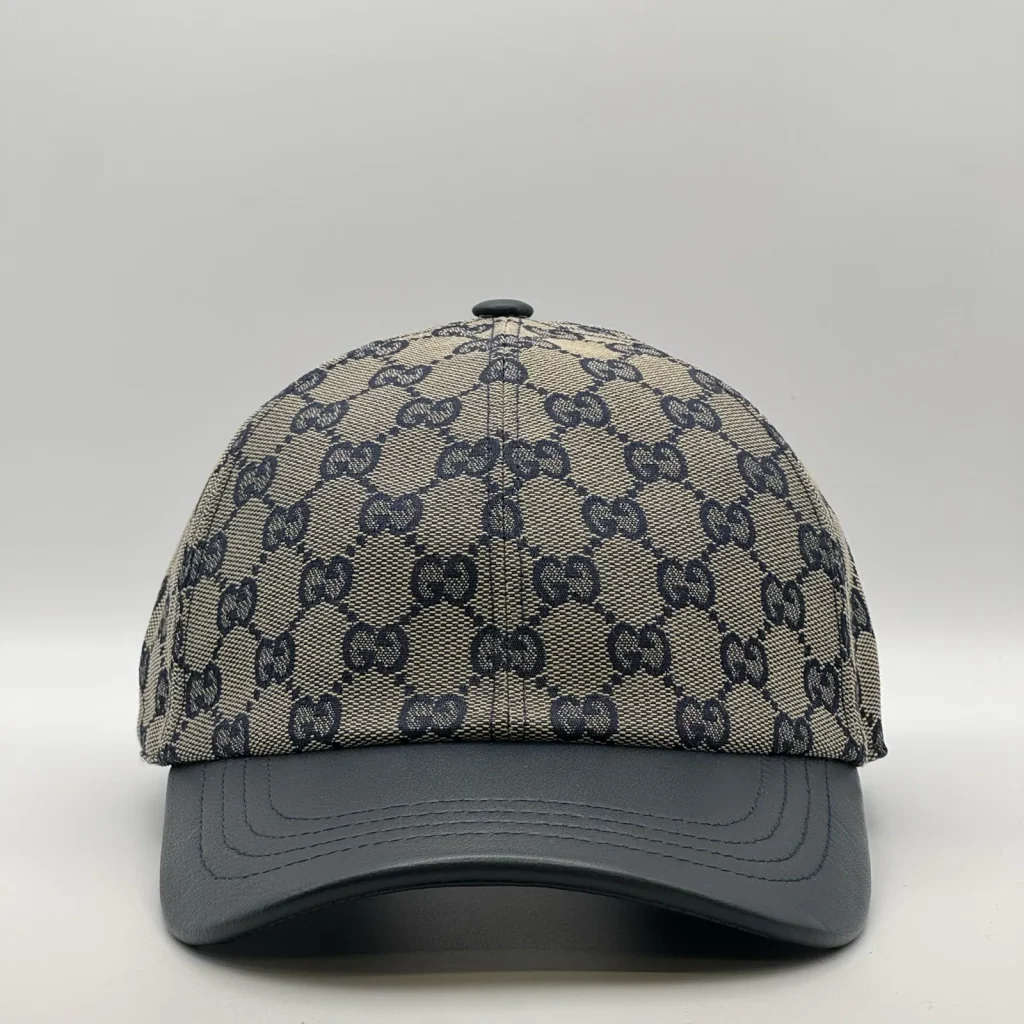 Navy GG canvas cap, front three-quarter view with a navy leather brim