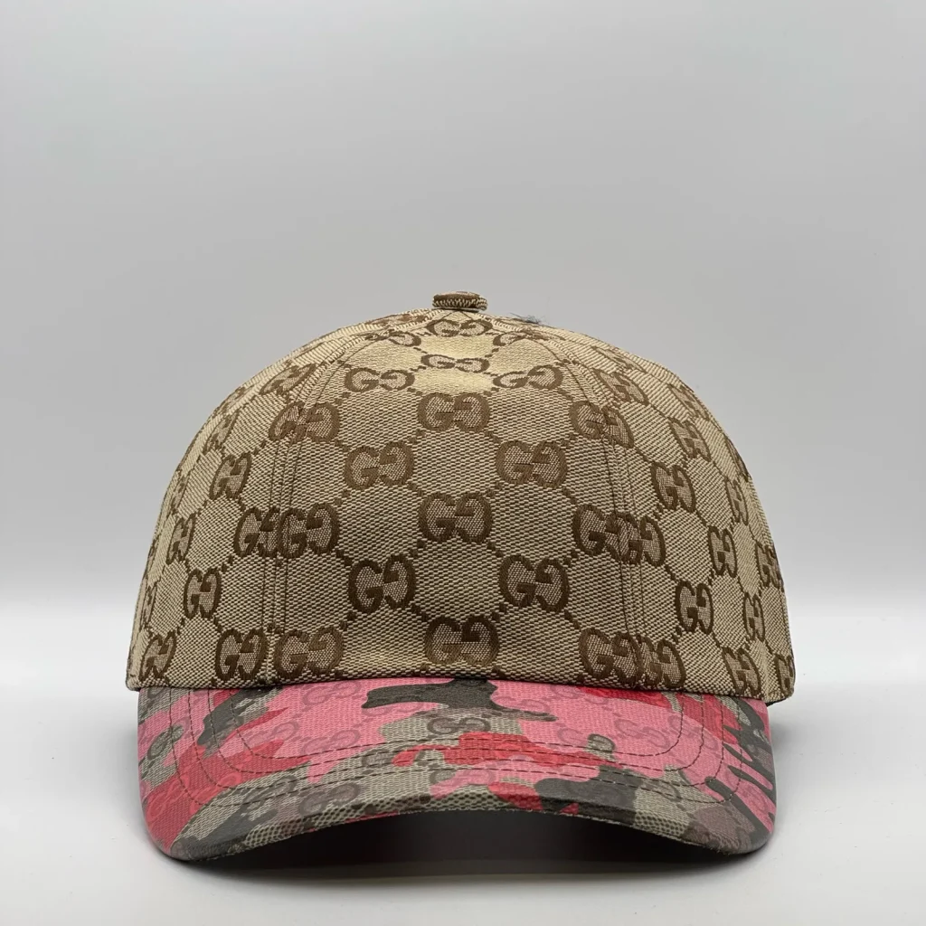 Beige GG canvas cap, front three-quarter view with a pink and olive floral brim