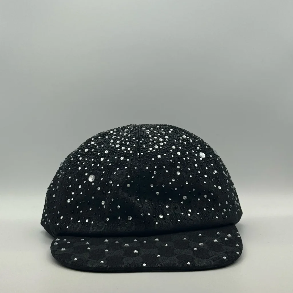 Black cap with scattered crystal embellishment, front view