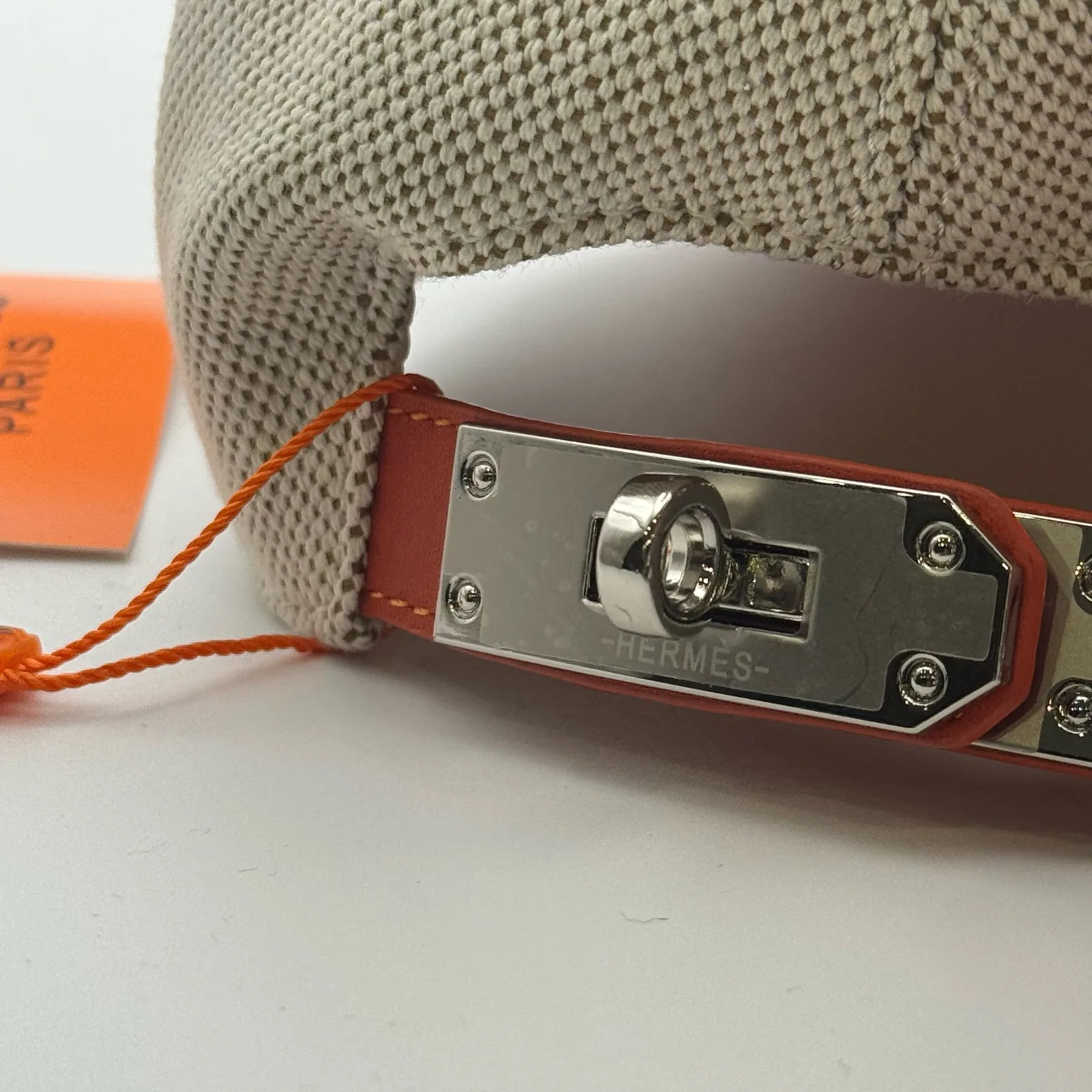 Close-up of the metal turn-lock buckle on the back strap.