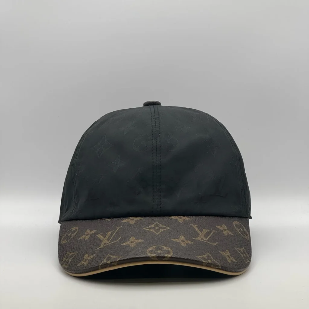 Black Louis Vuitton Monogram Brim cap, front view showing the monogram canvas brim.