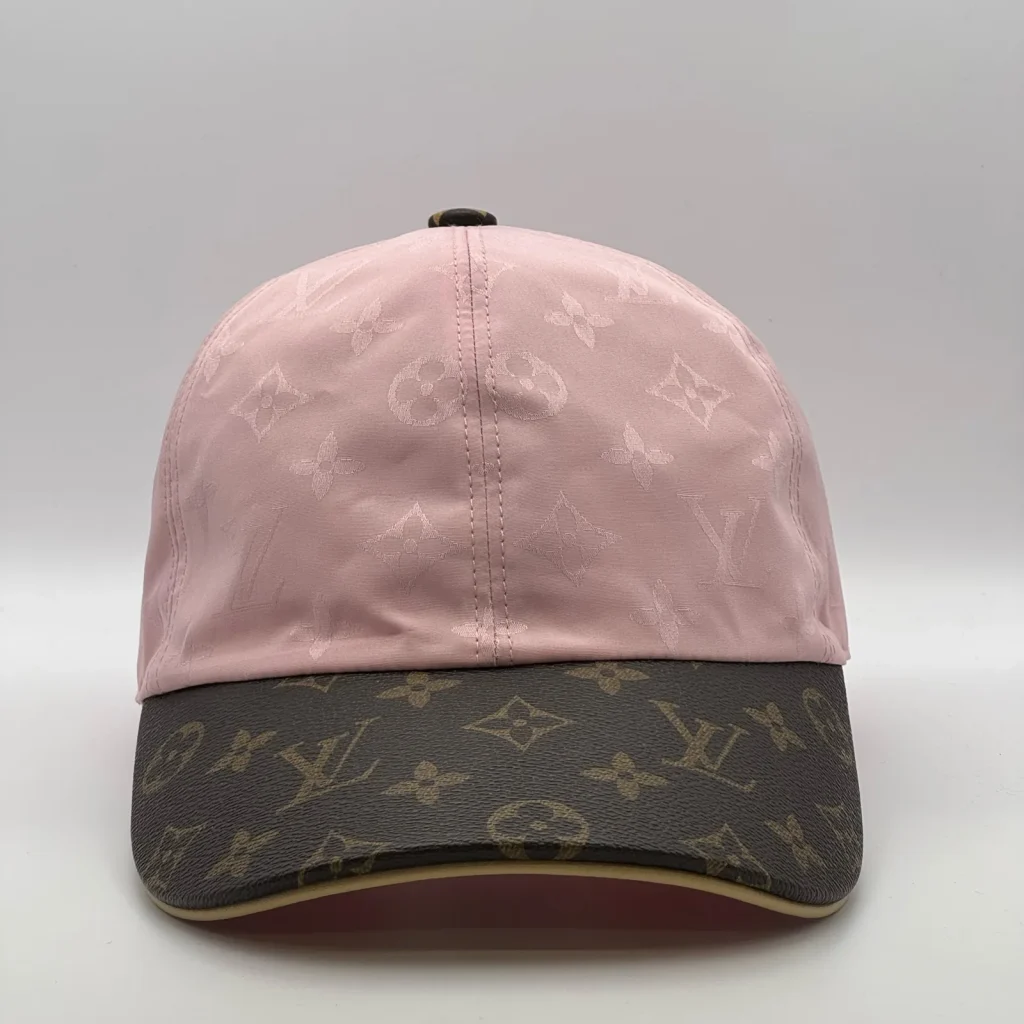 Pink Louis Vuitton Monogram Brim cap, three-quarter view showing the monogram canvas brim.