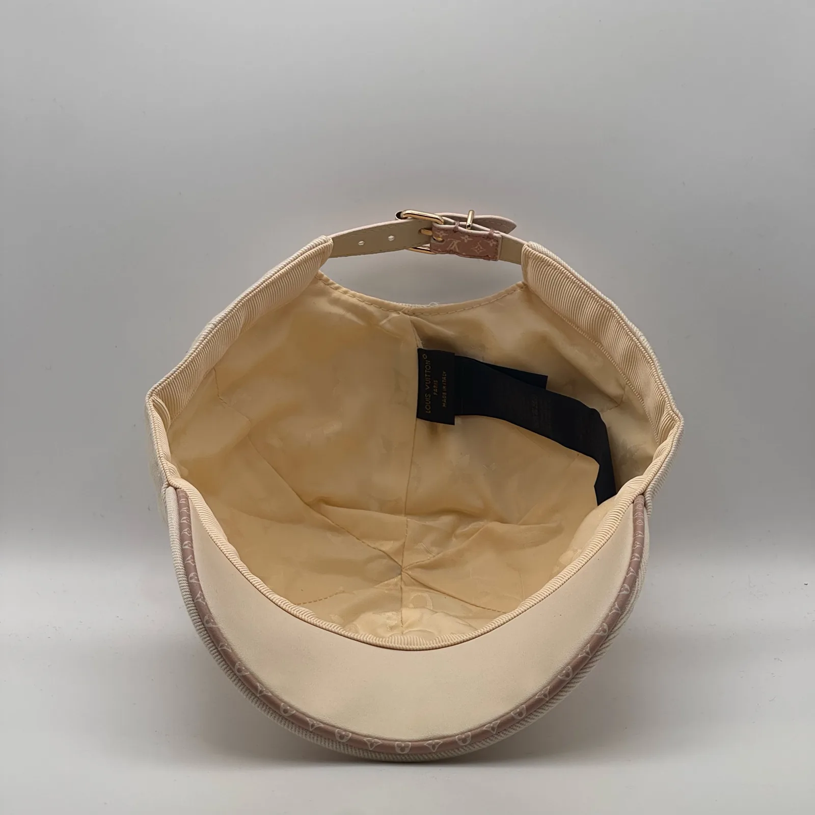 Top-down view inside the crown of the beige flower cap.