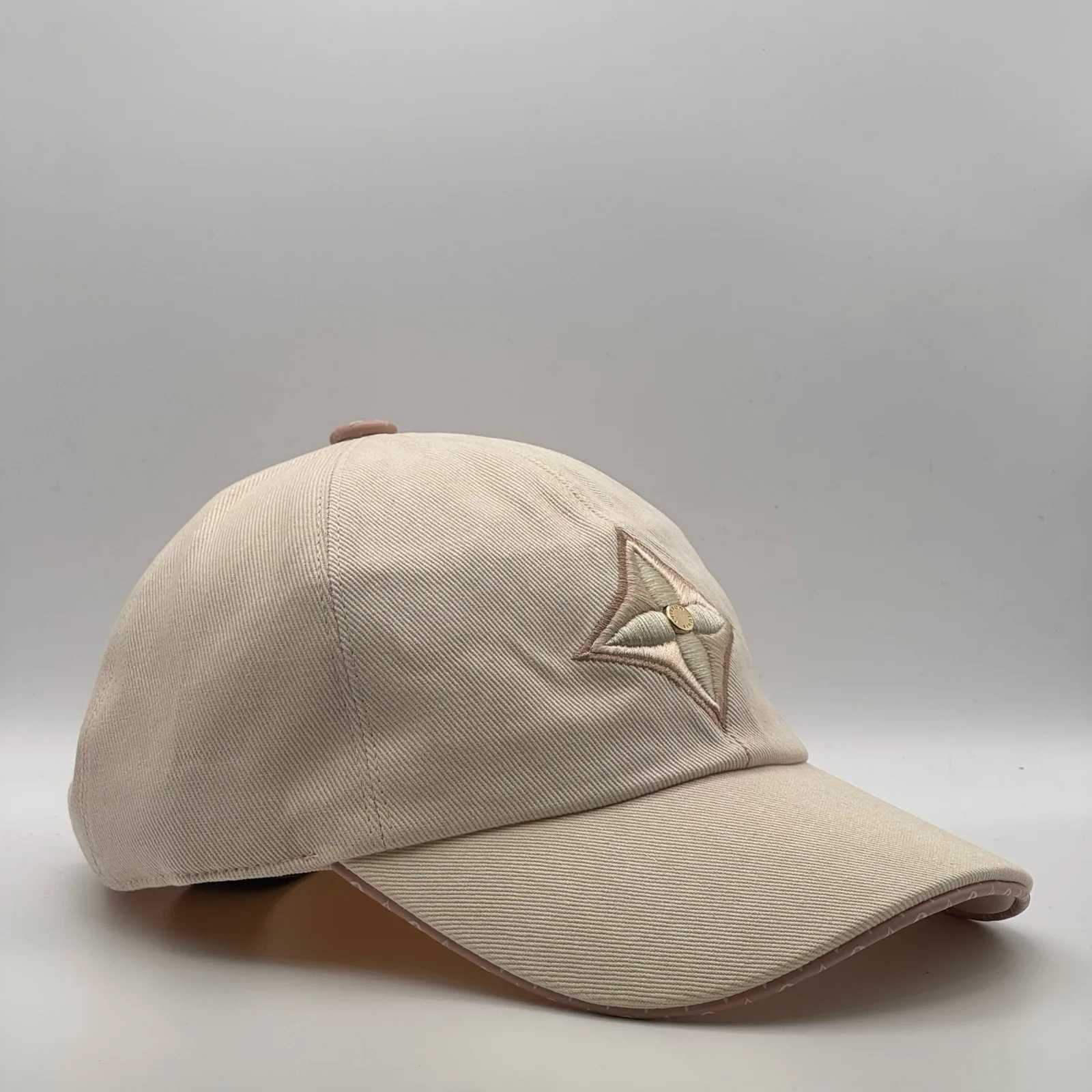 Beige flower cap, side profile view.